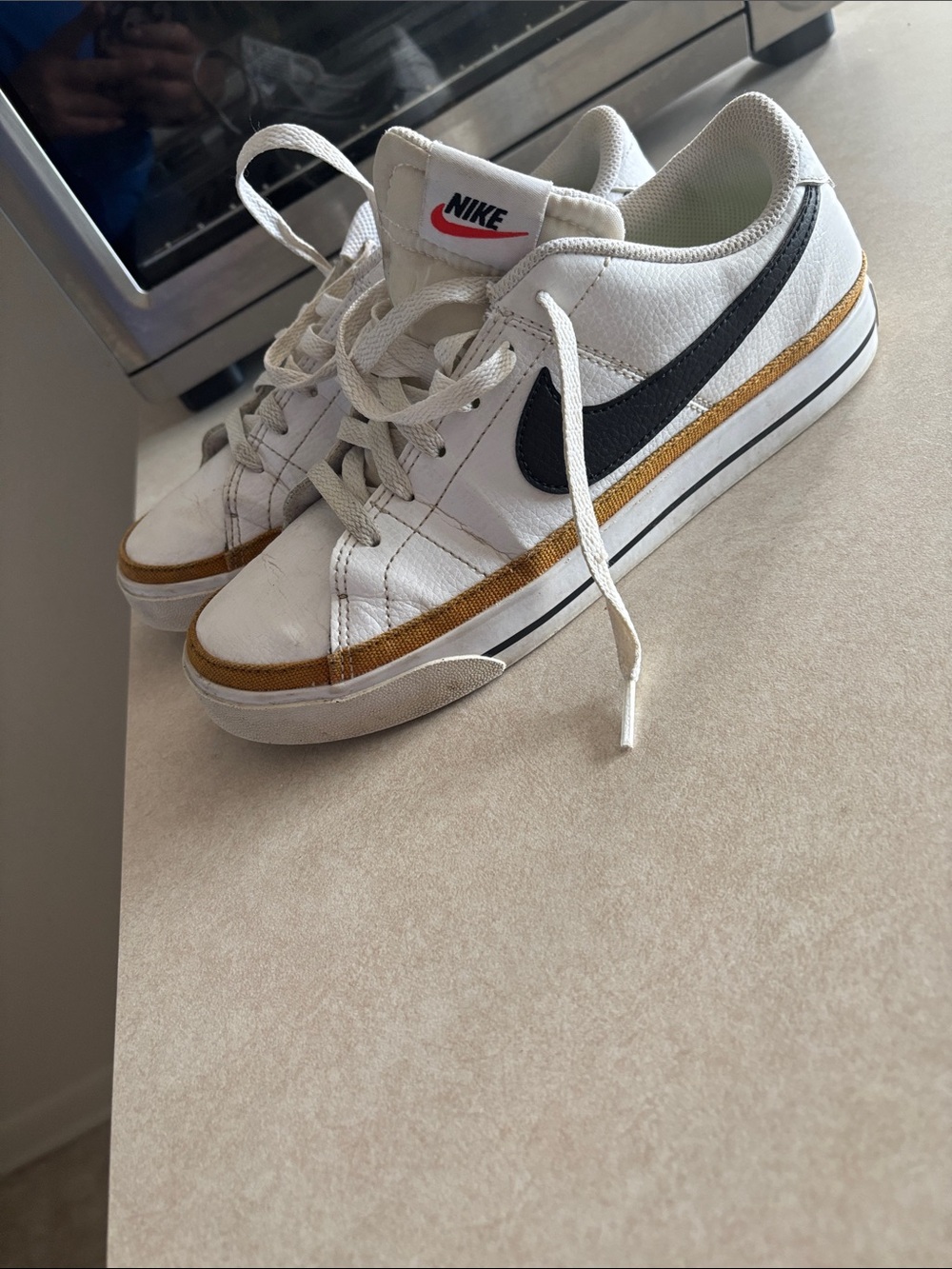 Nike Court Legacy White Sneakers with Black Swoosh and Gold Accent
